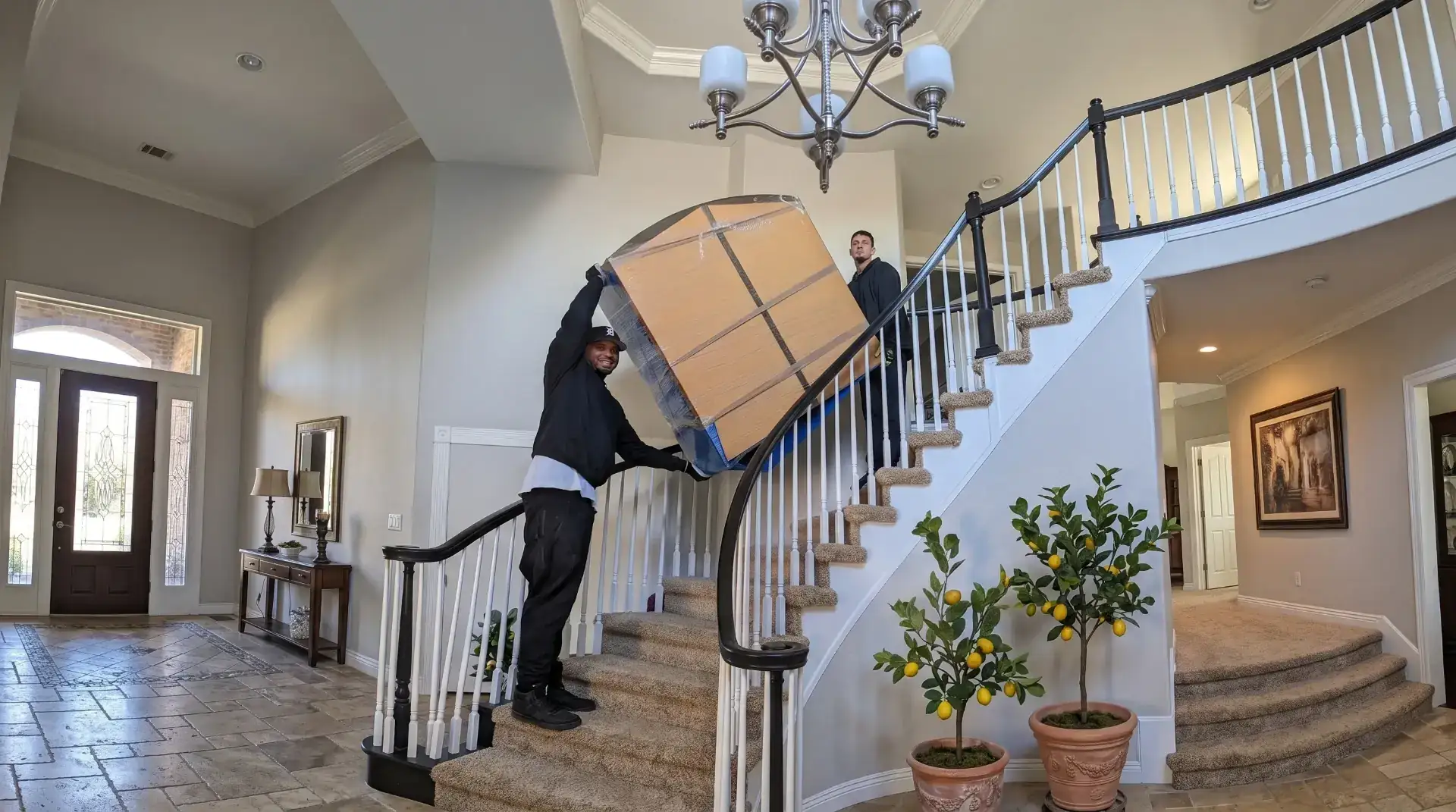 Licensed Omaha movers using professional equipment to move household furniture