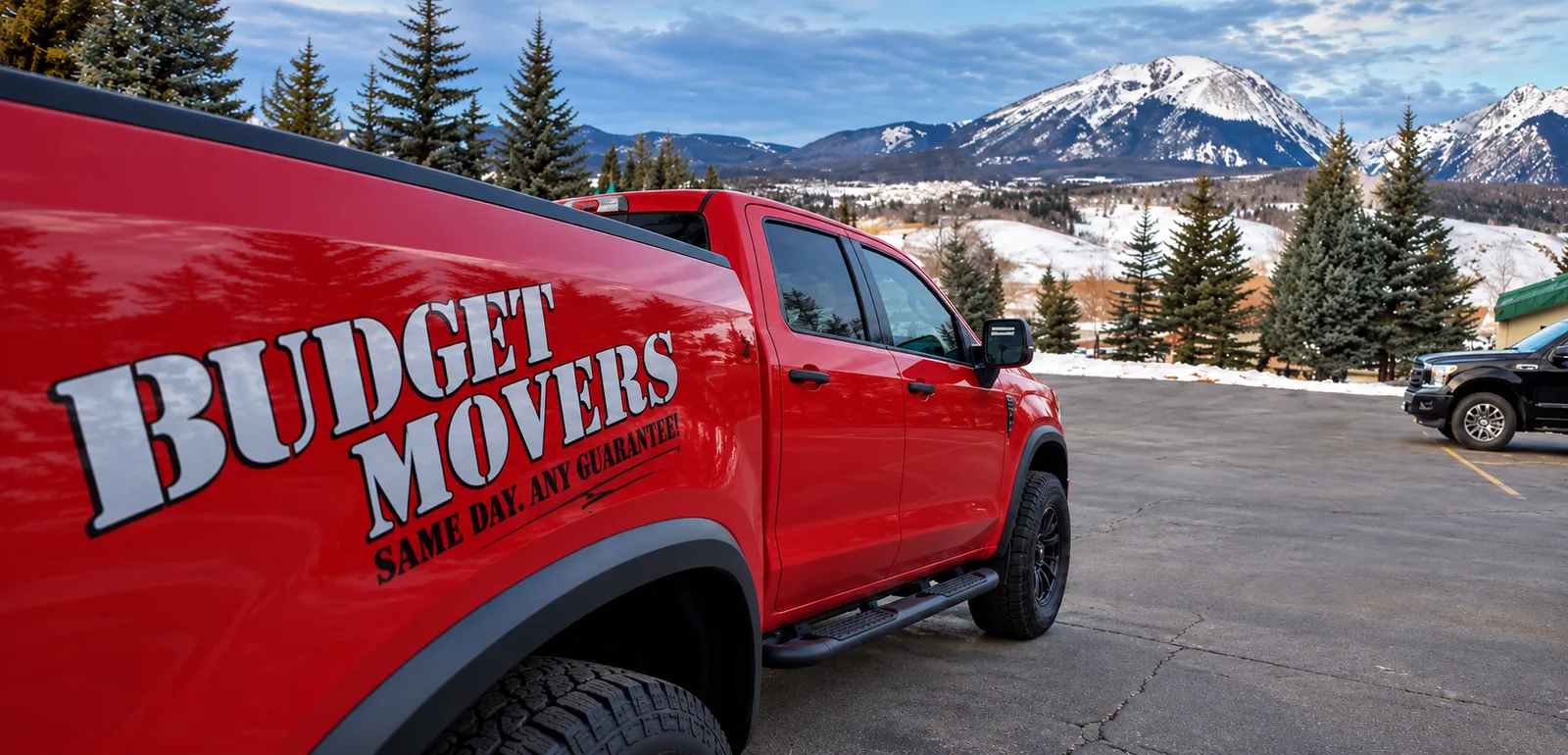 Budget Movers of Omaha crew member in front of the branded truck