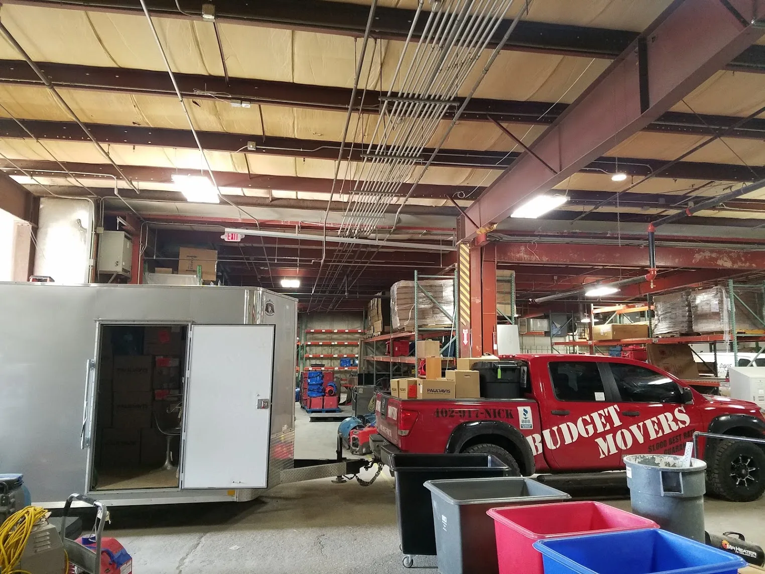 Budget Movers of Omaha team wrapping and protecting furniture